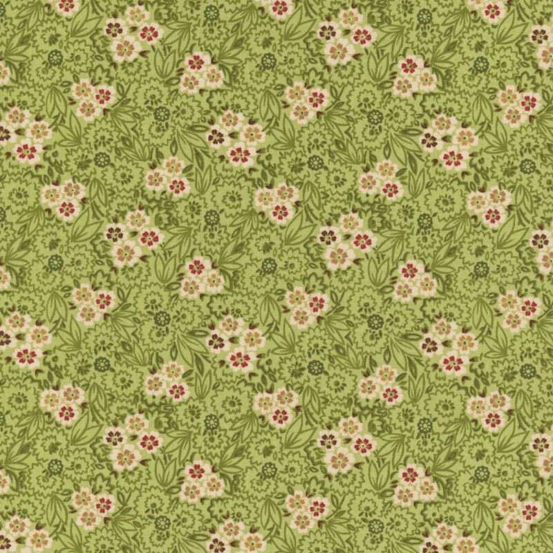 Green fabric featuring scattered yellow, red, and blue flowers with dark green swirling vines.