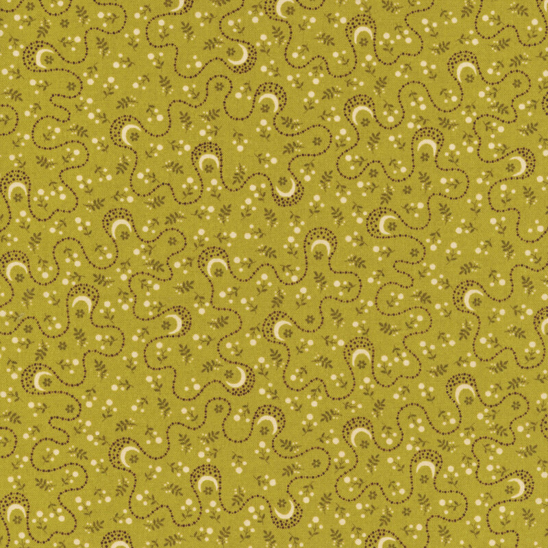 Green fabric featuring a print of white flowers and swirling brown dotted lines.