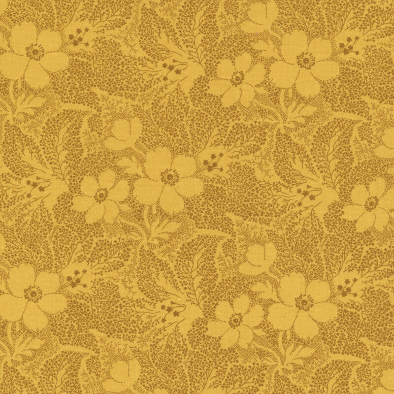 Yellow fabric with brown dots creating a floral and leaf pattern.