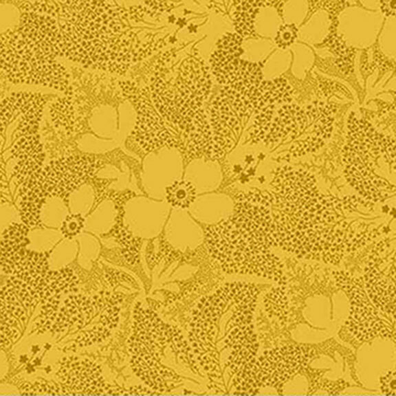 Yellow fabric with brown dots creating a floral and leaf pattern.