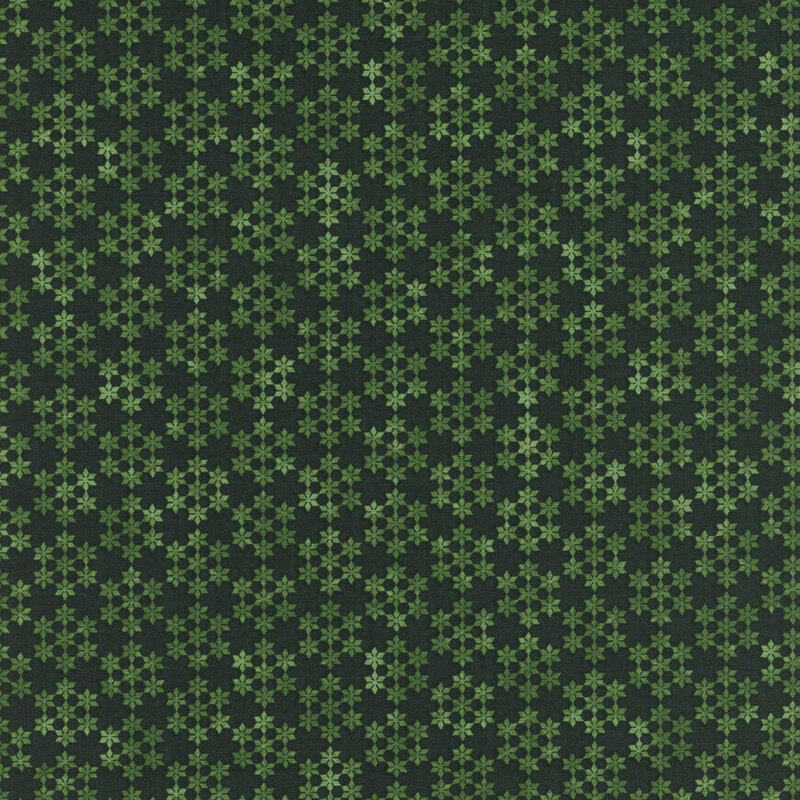 Green and dark green snowflake pattern on a textured background.