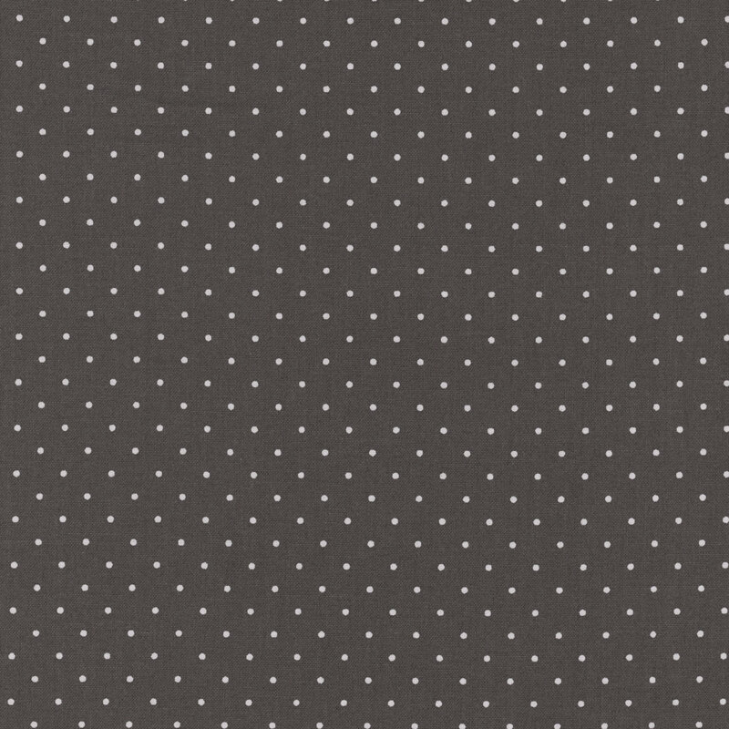 Warm black fabric with small gray polka dots. 