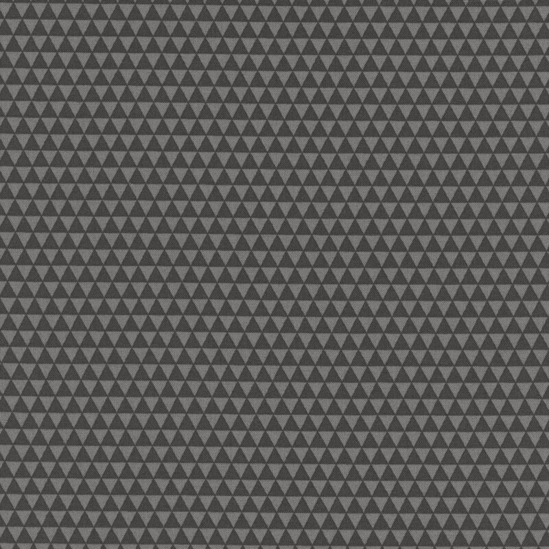 Warm black fabric featuring a repeating pattern of small triangles.