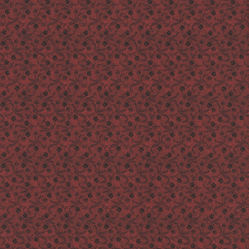 Red floral pattern on a dark red background. 