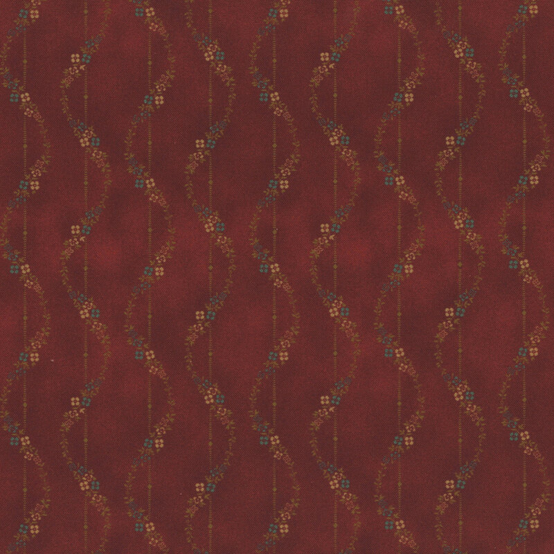 Textured red fabric with wavy lines and floral motifs in shades of gold and brown.