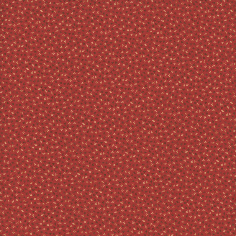 A rich red fabric with a subtle pattern of small, light-colored floral motifs.