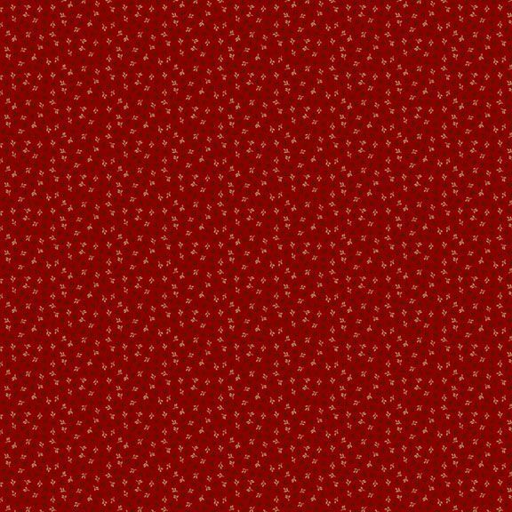 A rich red fabric with a subtle pattern of small, light-colored floral motifs.