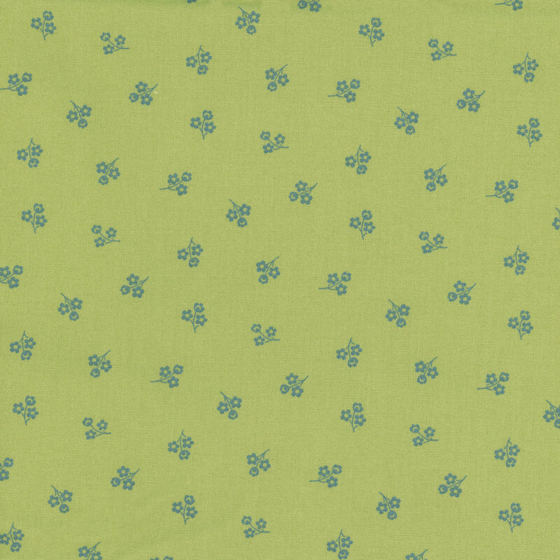 Green fabric with a repeating pattern of small blue flowers.