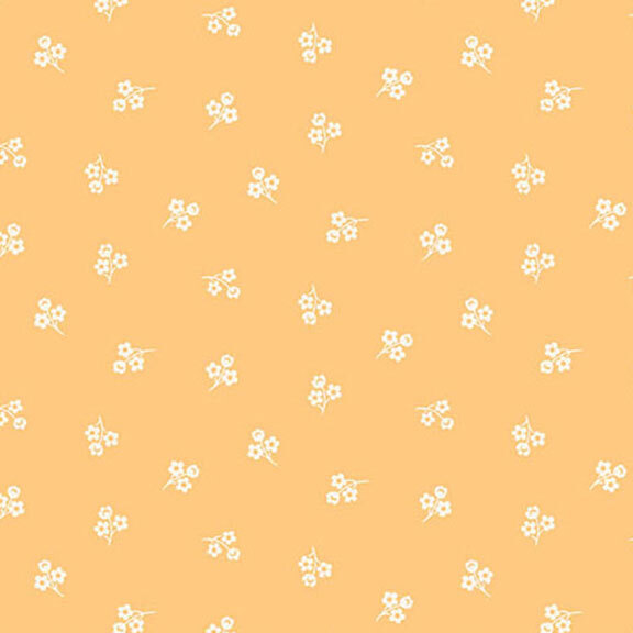 Light orange fabric with a repeating pattern of small white flowers.