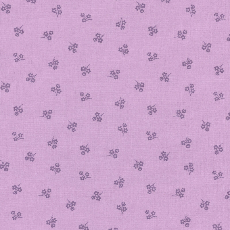 Purple fabric with a repeating pattern of small purple flowers.