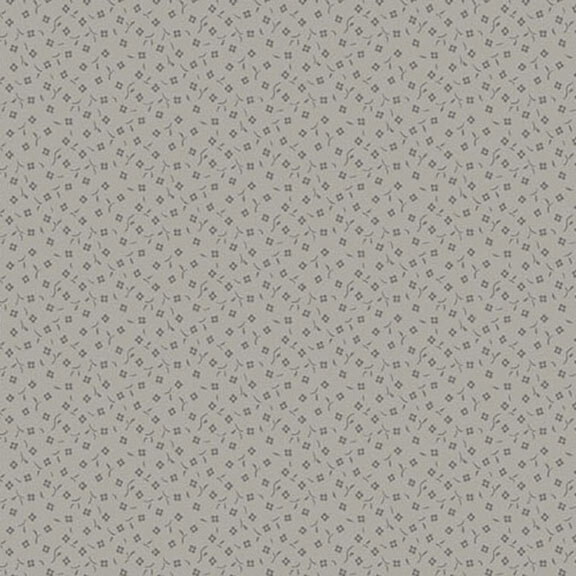 Gray fabric featuring a repeated pattern of small square shapes.