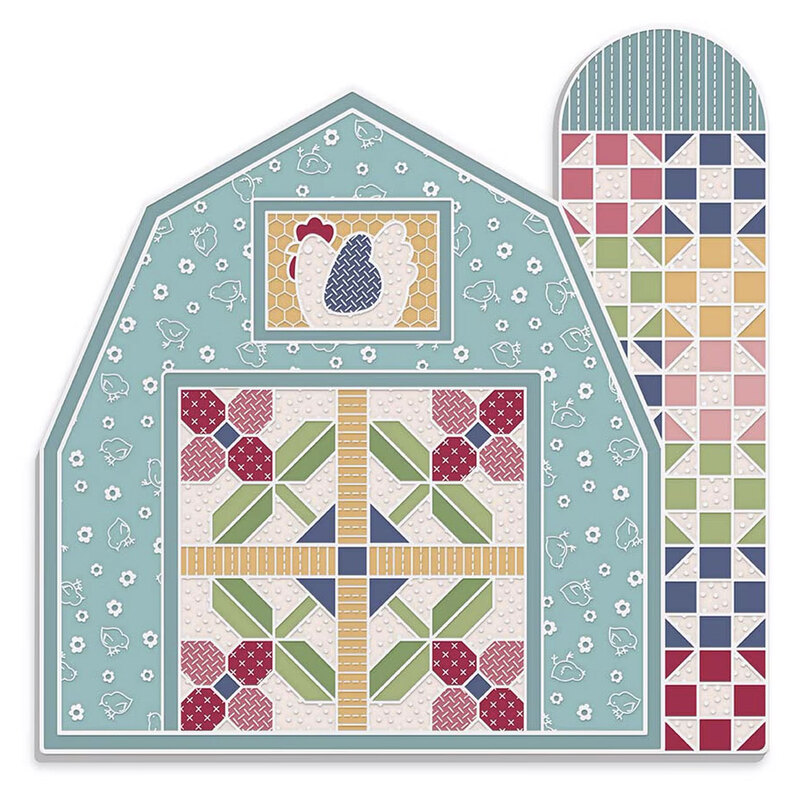 Enamel scissor and needle minder with the design of a barn and silo, isolated on a white background.