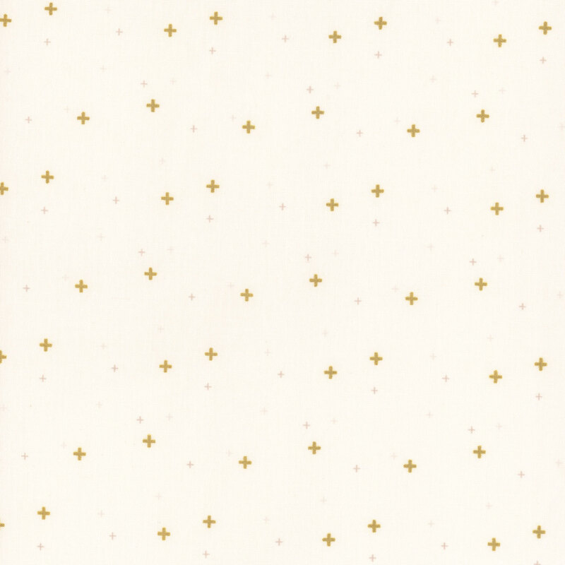 off-white fabric with gold metallic plus signs/crossed lines scattered all over.