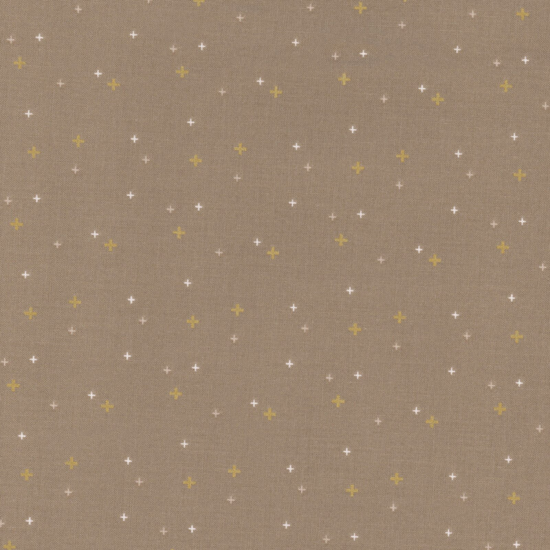Brown fabric with gold metallic plus signs/crossed lines scattered all over.