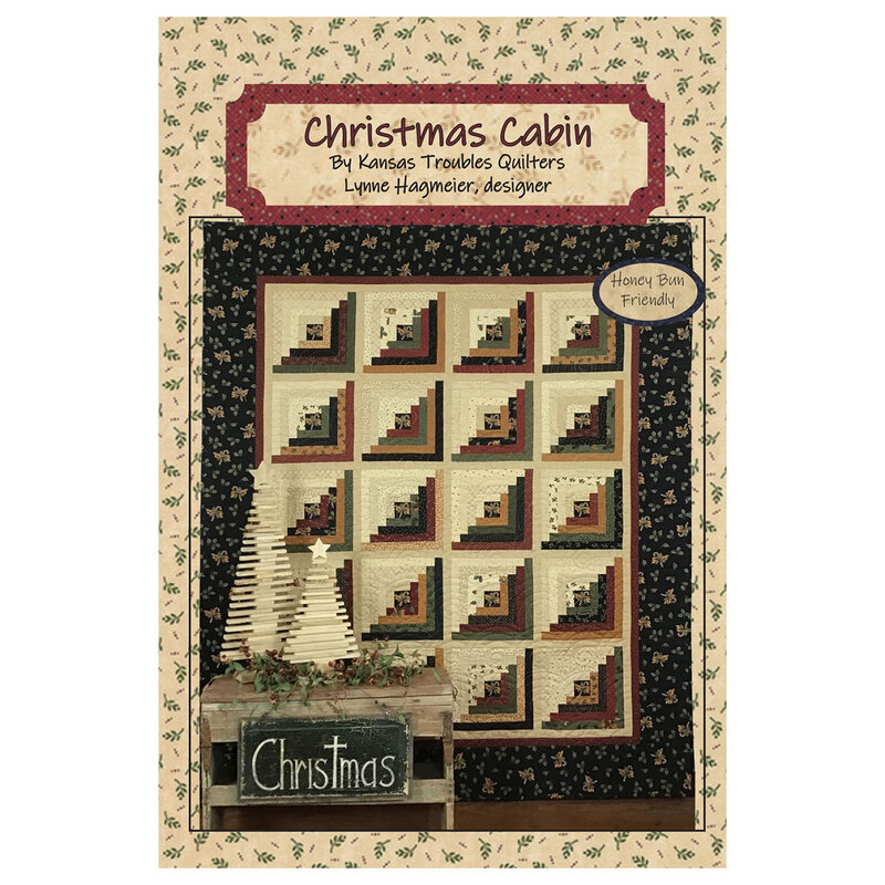 The front of the pattern featuring the finished quilt on a fabric background.