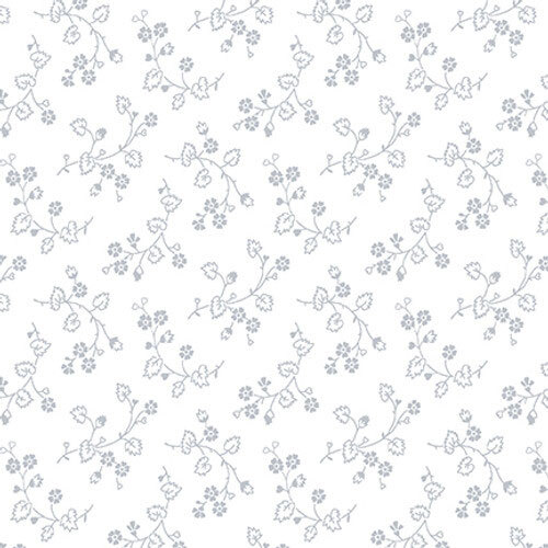 White-on-white fabric with a design of tossed vines and small florals.