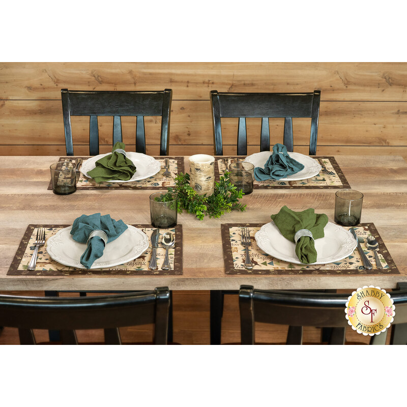 A shot of a table with four table settings using the placemats and coordinating cutlery, napkins and decor.