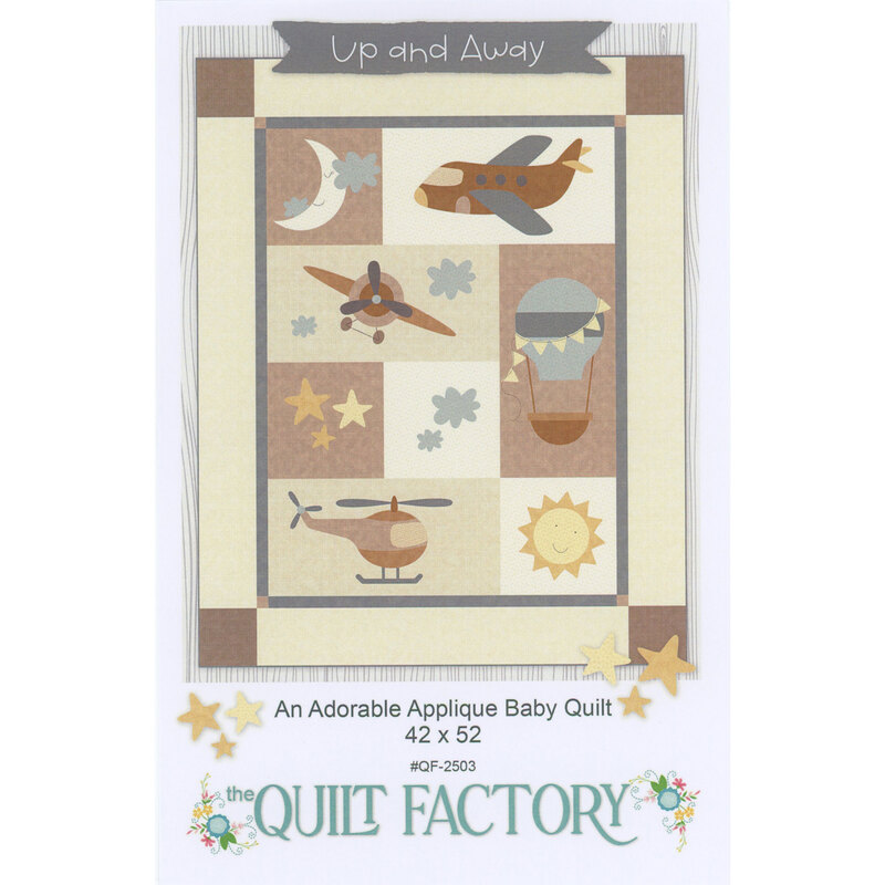 A quilt featuring colorful appliqué designs of airplanes, a hot air balloon, and celestial elements.