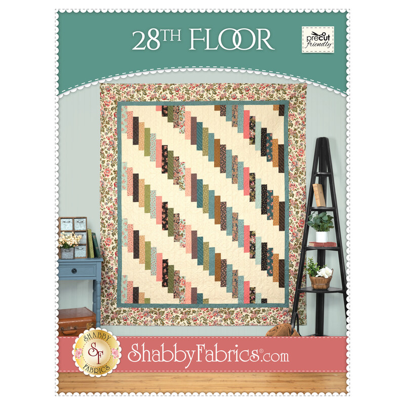 Front cover of the project featuring the completed 28th Floor Quilt, colored in cream, teal, brown, pink, gold, and black fabrics from the Collections for a Cause - Unity collection.