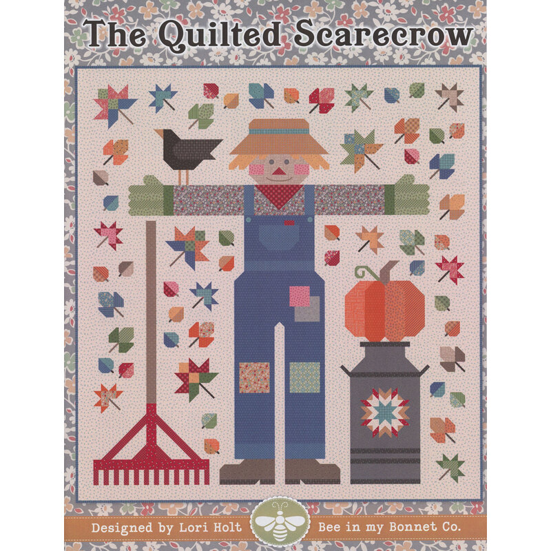 A colorful quilt design featuring a scarecrow surrounded by leaves, a crow, and gardening tools.