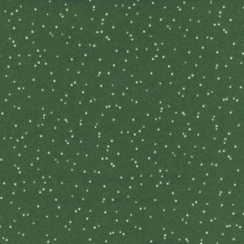 Green fabric with scattered white polka dots.