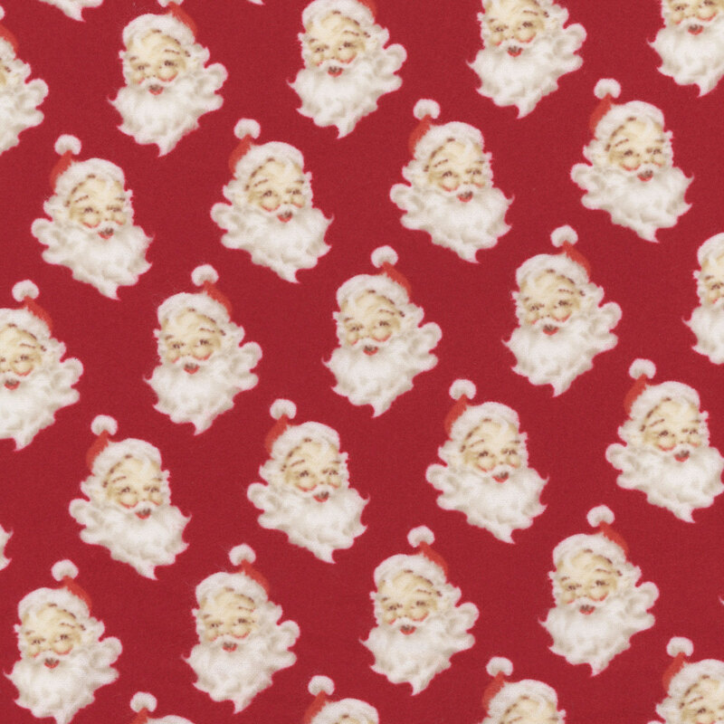 Red fabric with a repeating pattern of Santa Claus faces surrounded by fluffy white beards.