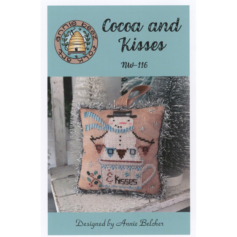 Cover of Cocoa and Kisses pattern featuring a snowman with a mug and the text Cocoa and Kisses.