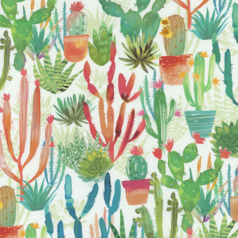 Vivid desert cacti and florals in reds, teals and greens on white fabric.