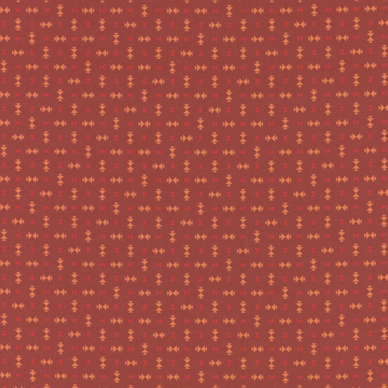 Tonal red fabric featuring scattered geometric designs.