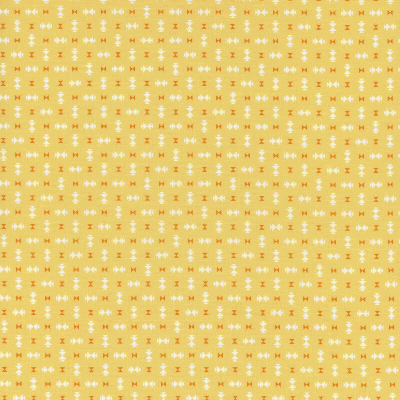 Yellow fabric featuring scattered geometric designs in orange and white.