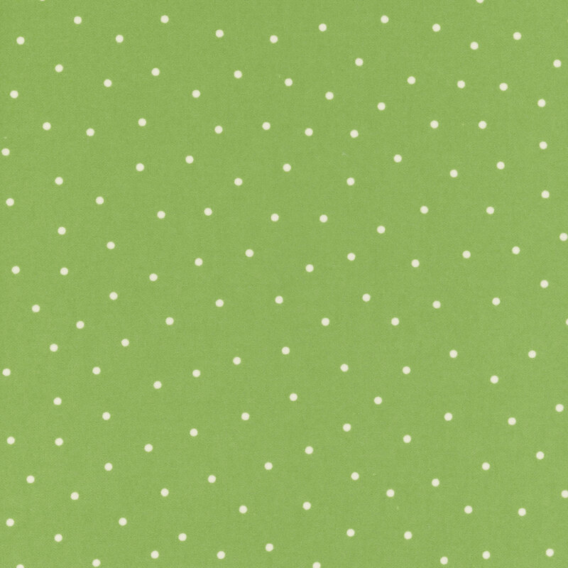 Grass green flannel fabric with scattered white dots.