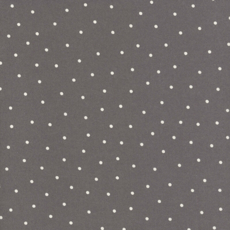 Gray flannel fabric with scattered white dots.