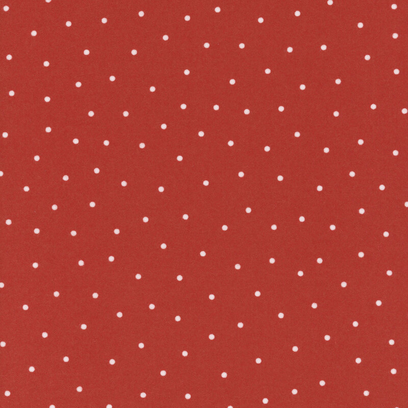 Red flannel fabric with scattered white dots.