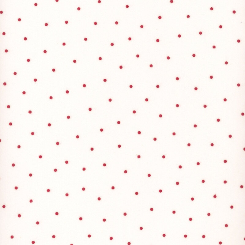 White flannel fabric with scattered red dots.