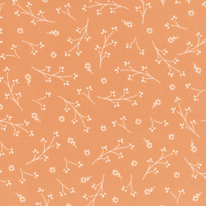 Light peach fabric with tossed floral sprigs.