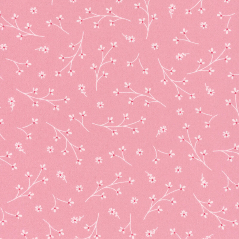 Light pink fabric with tossed floral sprigs.