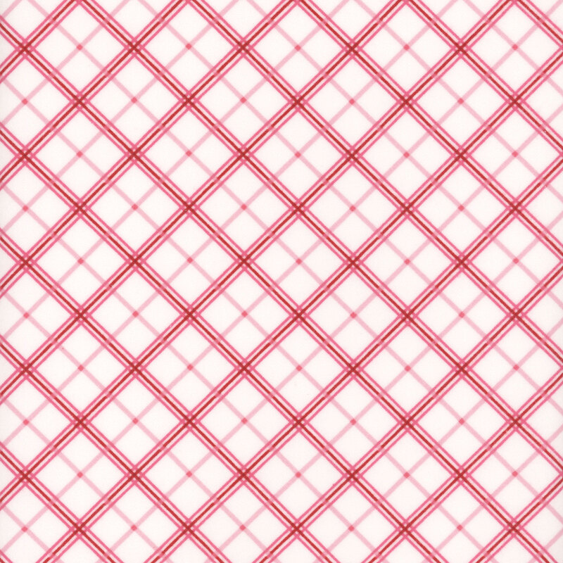 White fabric with a design of diagonal red plaid.