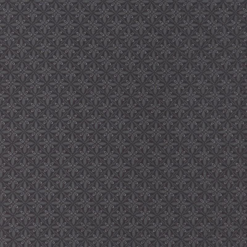 Black fabric with ornamental florals in a lattice pattern.