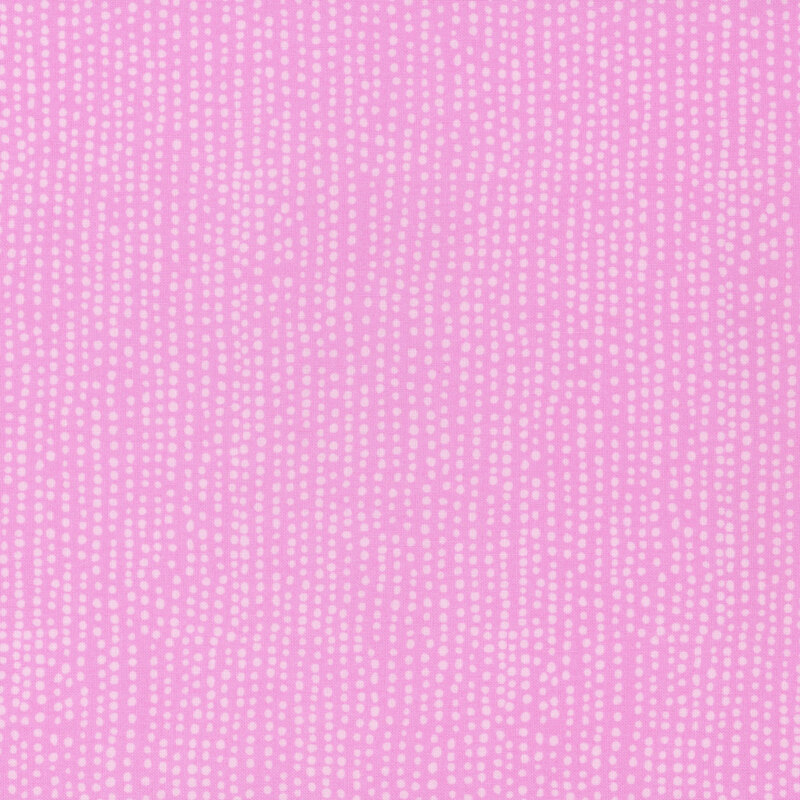 Bubblegum pink fabric with vertical rows of wobbly tonal dots.