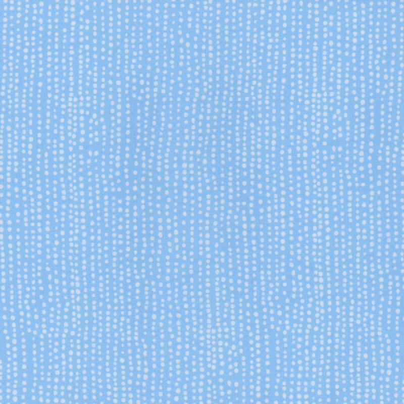 Light periwinkle blue fabric with vertical rows of wobbly sky blue dots.