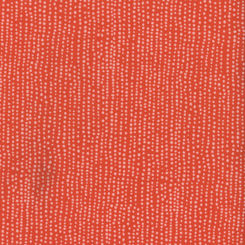 True red fabric with vertical rows of wobbly light red dots.
