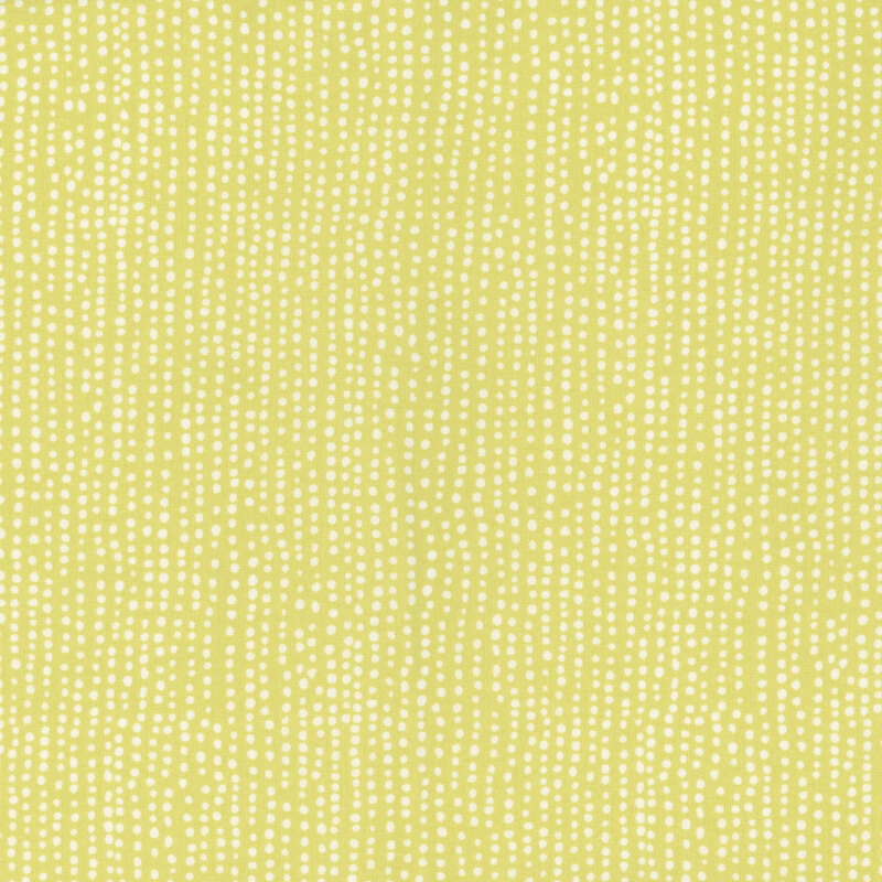 Light chartreuse fabric with vertical rows of wobbly white dots.