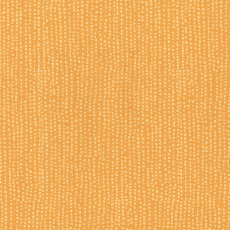 Tangerine orange fabric with vertical rows of wobbly tonal orange dots.