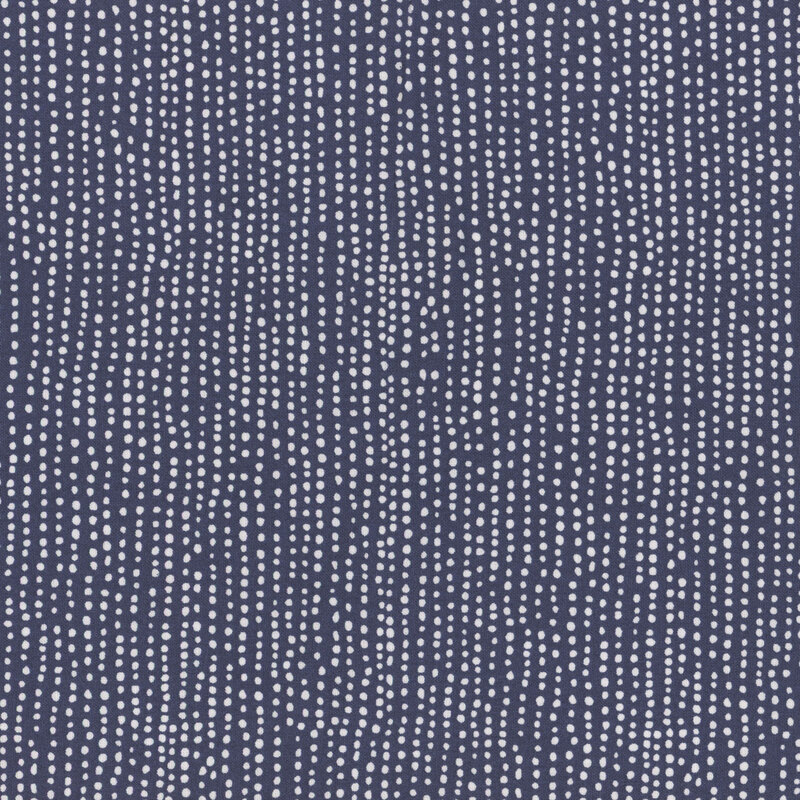 Navy blue fabric with vertical rows of wobbly white dots.