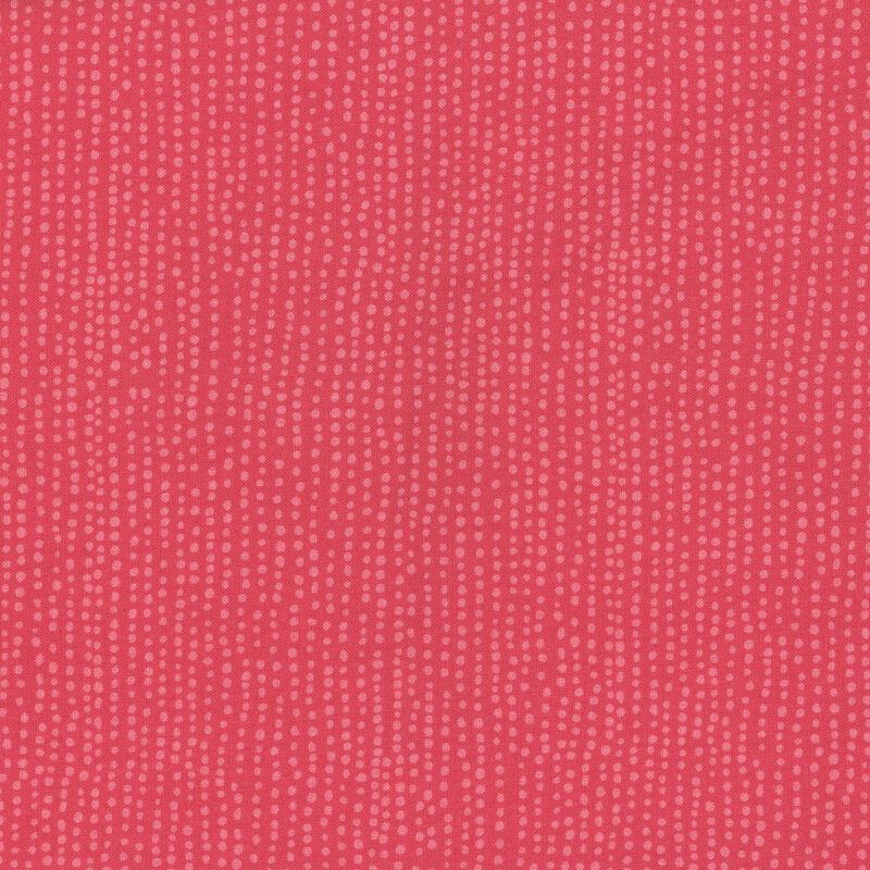Poppy red fabric with vertical rows of wobbly tonal dots.