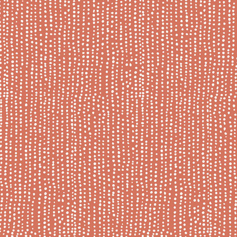 Burnt orange fabric with vertical rows of wobbly white dots.
