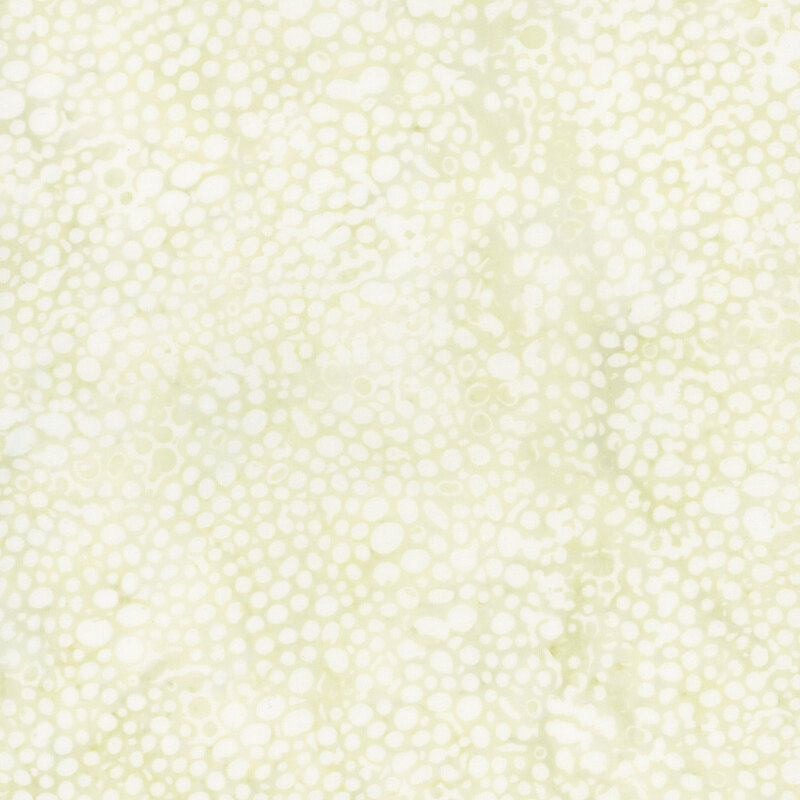 Abstract pattern featuring soft, light green circles on a creamy fabric.