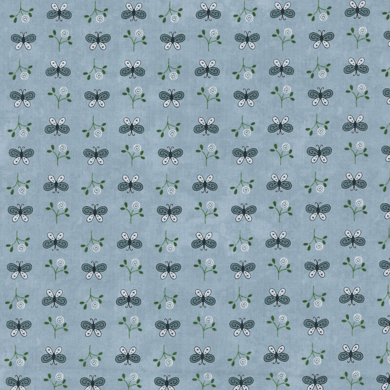 Repeating fabric of butterflies and floral elements on a dusty blue background.