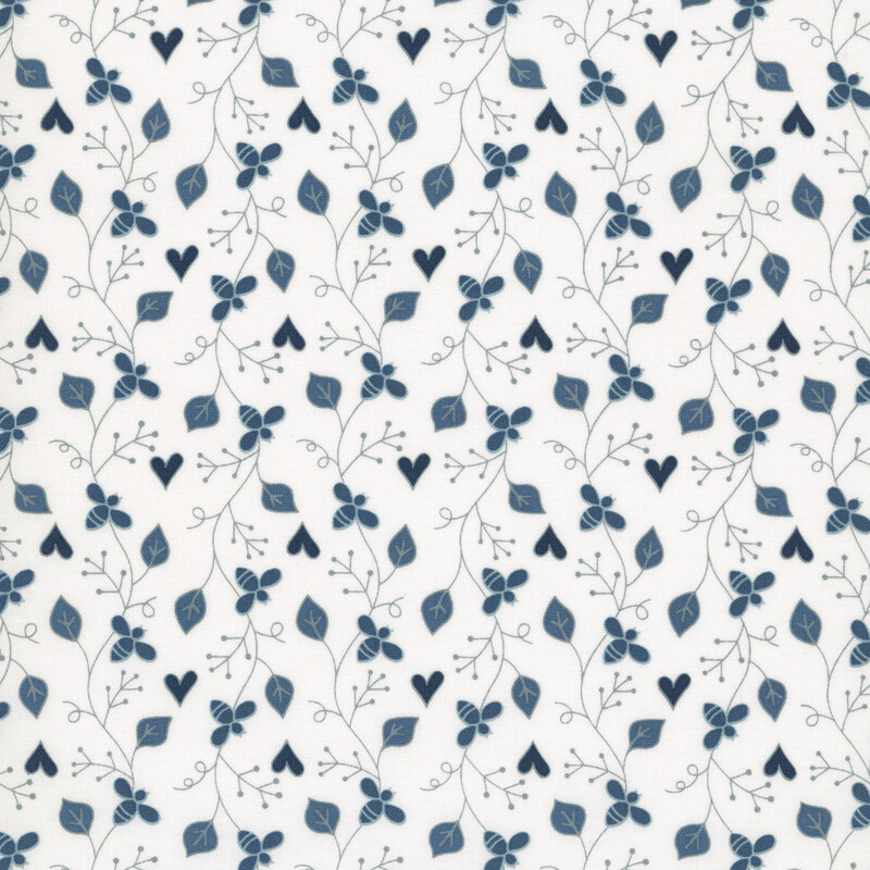A repeating pattern of blue leaves and flowers on a white fabric, featuring hearts and swirls.