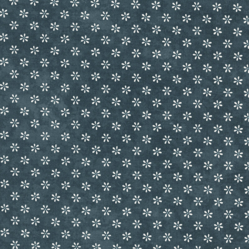 A dark indigo fabric pattern featuring small, white, stylized flowers arranged evenly.